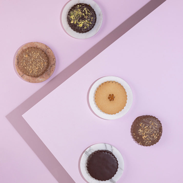 A gourmet Sablé selection, coated in premium chocolate and presented for gifting