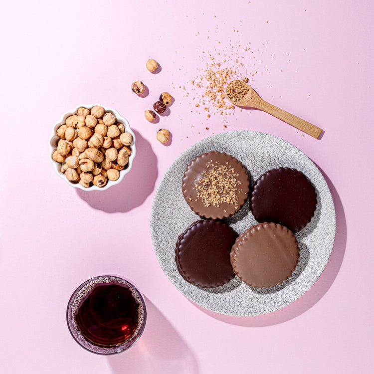 A refined arrangement of Dark Chocolate Sablés on a marble surface, highlighting their rich flavors