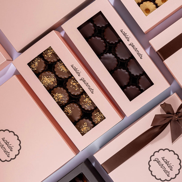 A refined arrangement of Dark Chocolate Sablés on a marble surface, highlighting their rich flavors