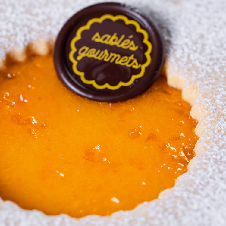 A festive holiday table showcasing gourmet Sablés and premium confections for celebrations