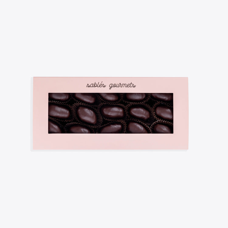 Close-up of premium dates coated with bold dark chocolate, perfect for gifting or indulgence