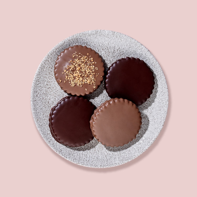 Luxurious display of Milk Chocolate Sablés on a wooden platter, perfect for gourmet gifting