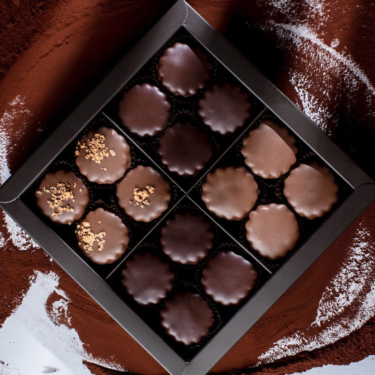 A beautifully arranged assortment box showcasing gourmet Sablés and artisan treats