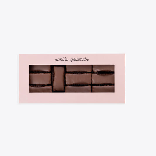 Close-up of a gourmet coconut wafer with a smooth milk chocolate coating