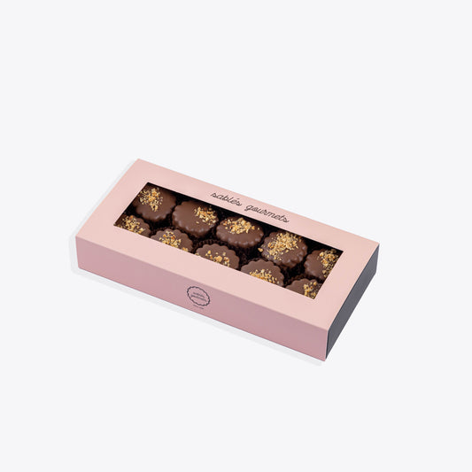 A small box of hazelnut Sablés, featuring buttery biscuits with a creamy hazelnut filling, ideal for personal indulgence