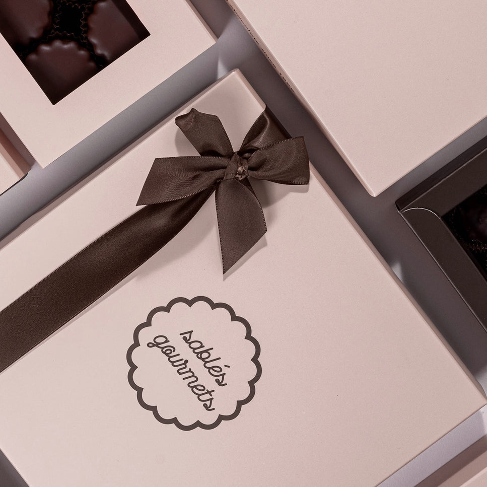 A beautifully arranged medium gift box featuring gourmet Sablés and decadent chocolate treats