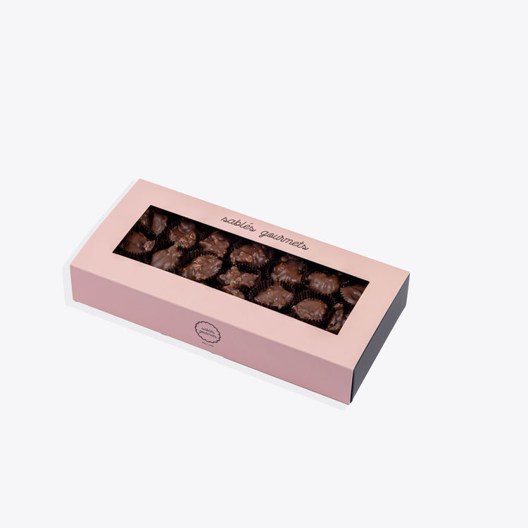 A handcrafted Milk Chocolate Rocher featuring rich chocolate and a crunchy texture, perfect for indulgence