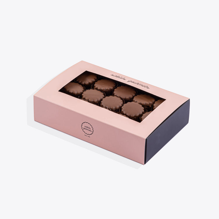 A medium box of milk chocolate Sablés, featuring buttery biscuits coated in creamy milk chocolate