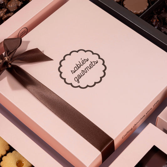 Gourmet Sablés displayed on a table with fresh ingredients and natural tie ribbon