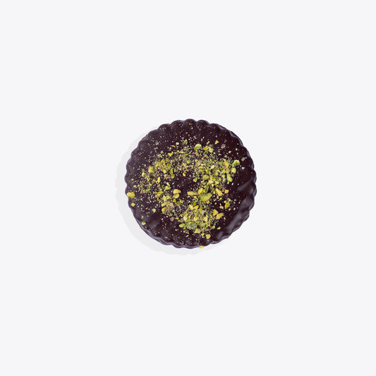 A buttery Sablé topped with crunchy pistachios and coated in premium chocolate, a perfect treat