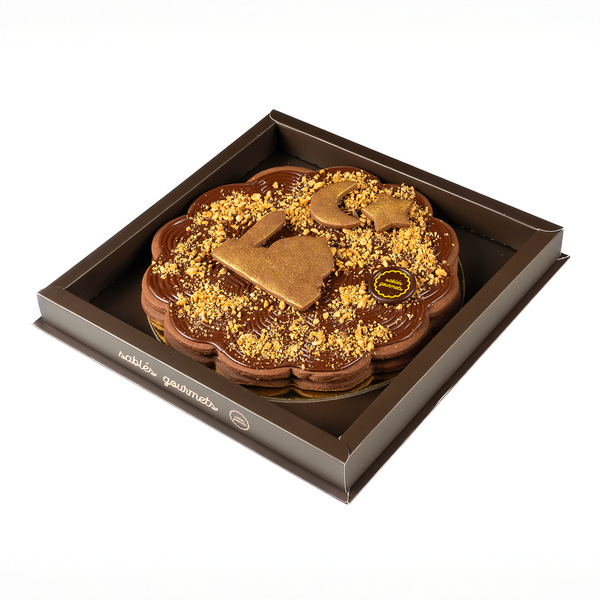 Chocolate tart with in a box on a white background