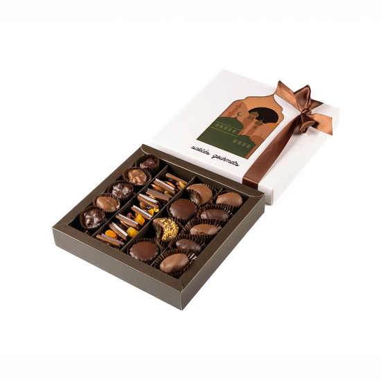 Open box of chocolates with a ribbon on a white background
