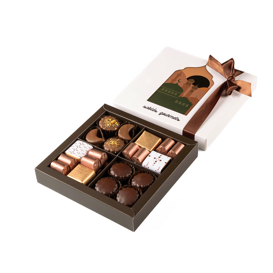 Box of chocolates with a brown ribbon on a white background