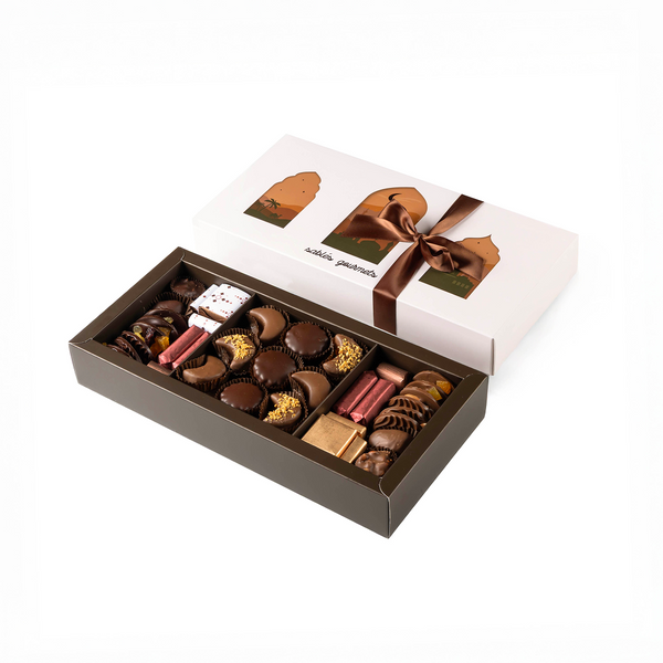 Box of assorted chocolates with a brown ribbon on a white background