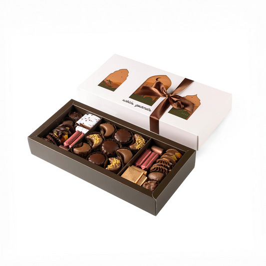 Box of assorted chocolates with a brown ribbon on a white background