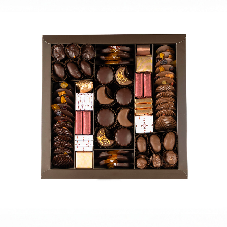 Assorted chocolates in a decorative box on a white background