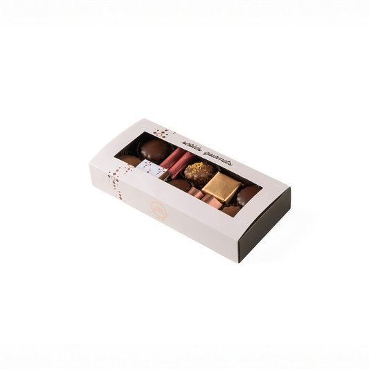 Box of chocolates with visible candies on a white background