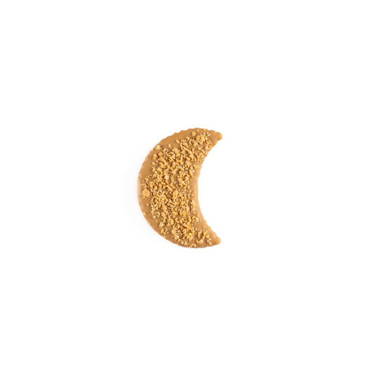Half moon-shaped cookie with textured surface on a white background