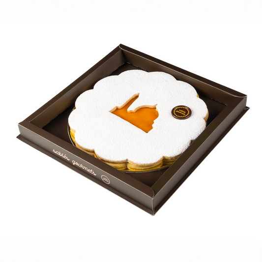Pastry in a brown box with 'whiler gourmets' branding on a white background