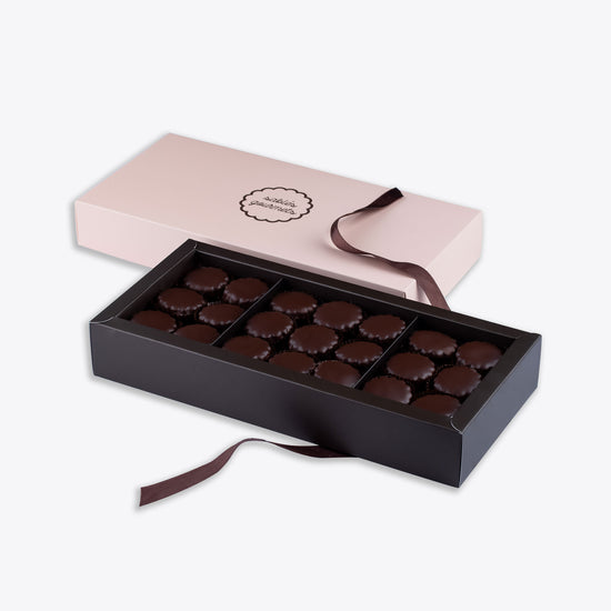 A large gift box of dark chocolate Sablés, featuring rich and indulgent flavors