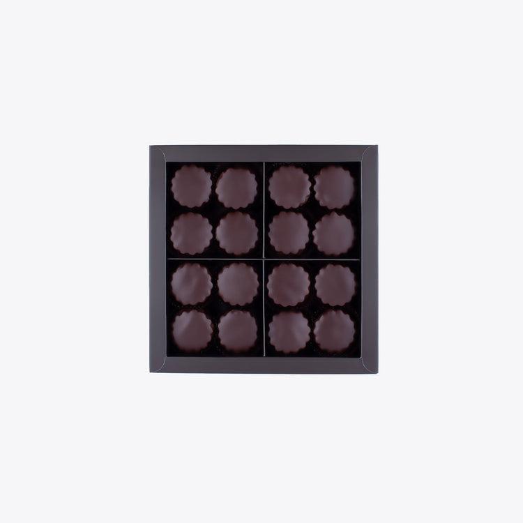 A square box of dark chocolate Sablés, perfect for gifting or personal indulgence